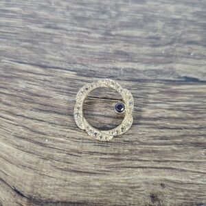 vintage gold-toned textured circle or wreath brooch